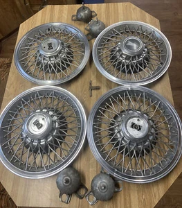 82-87 Grand Prix Wire Hub Caps 14” Set of 4 Key and Mount Brackets OEM 1 center - Picture 1 of 10