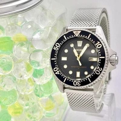 Reloj de buceo Seiko 2625-0010 esfera negra correa plateada batería reemplazada para damas Foto 1 de 4