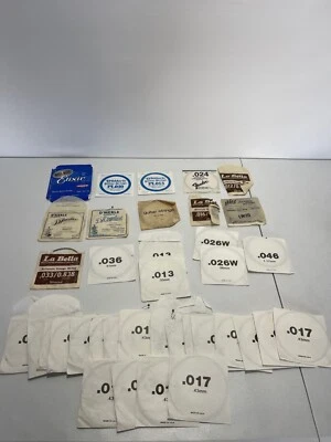 ENORME LOTE VINTAGE DE CUERDAS MANDOLINA GUITARRA GUARDABARROS ELIXIR D'MERLE LA BELLA Foto 1 de 4