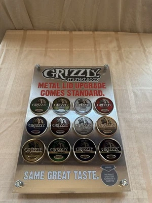 Memorabilia de tabaco para masticar tabaco con tapa de metal Grizzly 24 tapas Foto 1 de 4