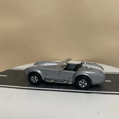 Matchbox Superfast #16 1965 Shelby Cobra 427 2005 S/C plateado con rayas blancas casi nuevo Foto 1 de 4