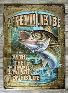 A Fisherman Lives Here With The Catch Of His Life 12" x 17" Embossed Metal Sign - Picture 1 of 2