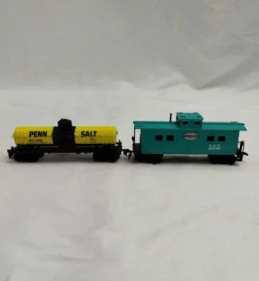 Lot of 2 Mantua HO Scale Carts Yellow Penn Salt Tank & Cyan NYC Central Caboose - Image 1 of 4