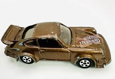 1981 Ertl винтажный Porsche 930 Turbo The Cannonball Run коричневый спортивный автомобиль 1/64 - Изображение 1 из 4