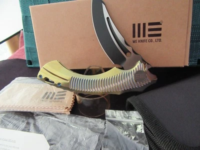 We Knife Co. Sea Monster. 713B. Ultra Rare. Gold Titanium NIB--Excellent - Image 1 of 4