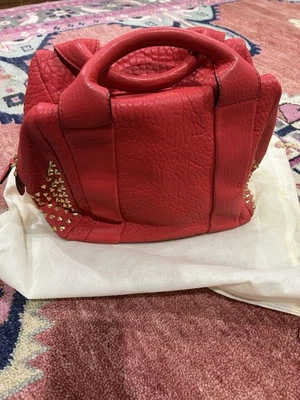 Bolso MCM Tachonado Cuero Guijarro Rojo Foto 1 de 4