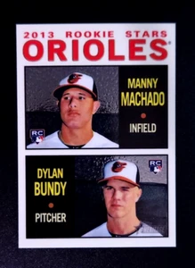 2013 Topps Heritage cromo #HC-94 Manny Machado Dylan Bundy Orioles novato/999 - Imagen 1 de 2