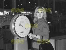 Photo - Mandy Rice-Davies candid portrait, Nice Airport, 1964