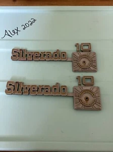 1975-80 CHEVY Truck SILVERADO 10 Emblems OEM #349694 Metal Pair - Picture 1 of 4