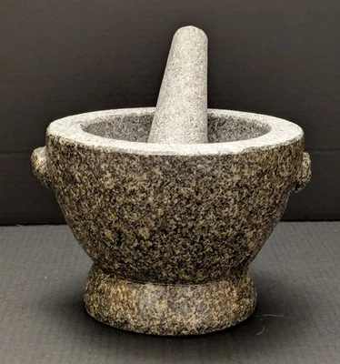 Mortero y mortero de piedra de granito Foto 1 de 4