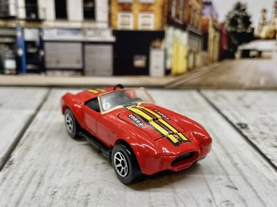 HOT WHEELS CLASSIC COBRA ROJO NEGRO BASE 7SP ERA TARJETA AZUL Foto 1 de 4