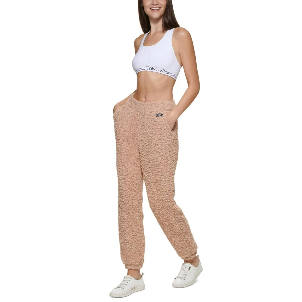 NUEVO CON ETIQUETAS CALVIN KLEIN PERFORMANCE Pantalones de chándal de punto peludo beige Sherpa medianos precio de venta sugerido por el fabricante $80 Foto 1 de 1