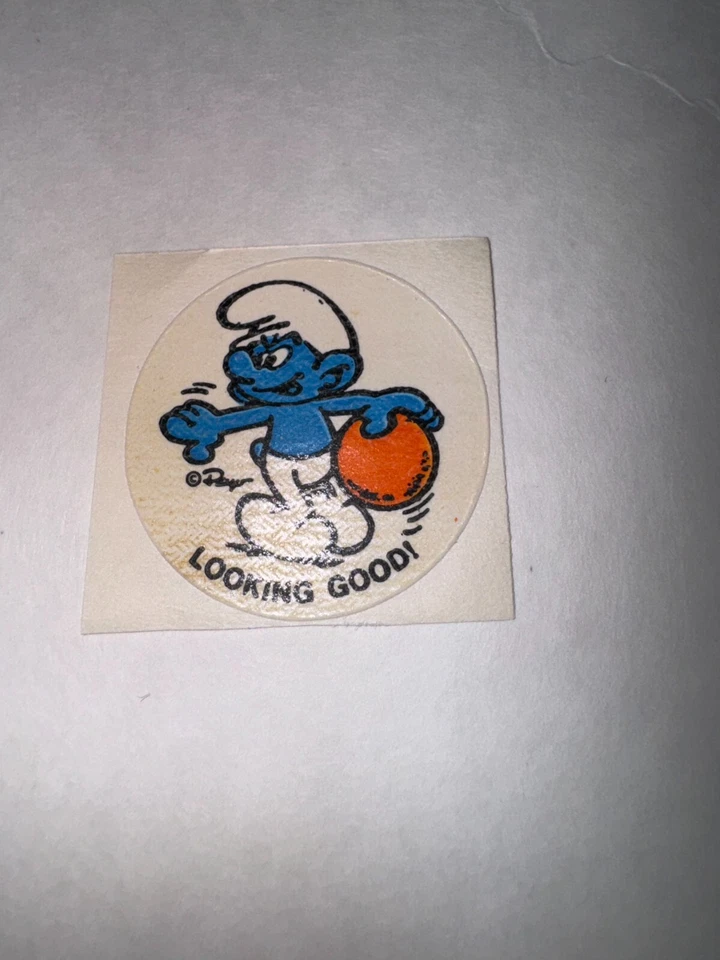 Pegatina naranja vintage años 80 Peyo Los Pitufos luciendo bien rascar y oler Foto 1 de 1