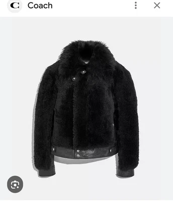 Chaqueta corta de aviador Coach Shearling negra. Talla 4. Venta al por menor $1900. ¡NUEVO CON ETIQUETAS! Foto 1 de 4
