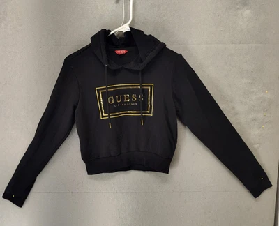 Guess Sudadera con Capucha Mujer Pequeña Negra Dorada Crop Pullover Los Angeles Logo Manga Larga Foto 1 de 4