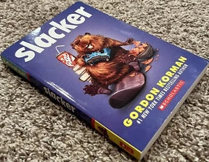 Brand New Slacker - Gordon Korman No 1 NYT Bestselling Author Scholastic - Bild 1 von 3