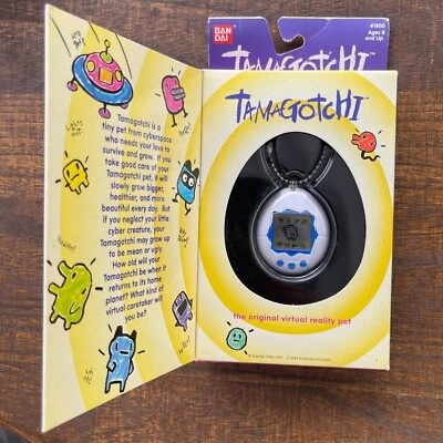 Bandai Tamagotchi 1997 mascota de realidad virtual original #1800 blanco con azul BTN Foto 1 de 4