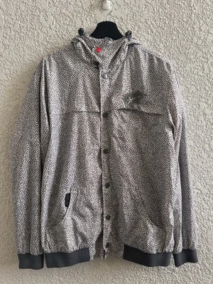 Chaqueta cortavientos mediana con cremallera estampado de elefante explosivo estrellas y correas famosas Foto 1 de 4