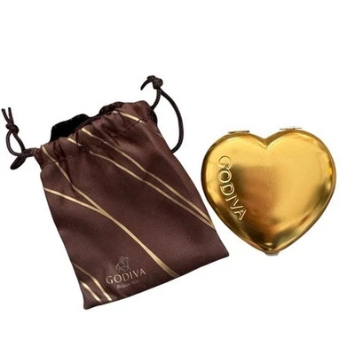 Espejo compacto Godiva dorado en forma de corazón con bolsa marrón Foto 1 de 2