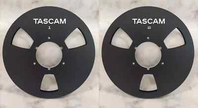 Un par de carretes de cinta de carrete a carrete de aluminio negro TASCAM 10,5"" 1/4 RE-1400... Foto 1 de 4