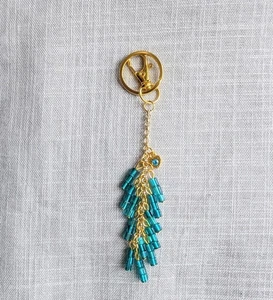 TÜRKIS & GOLD PERLEN TASCHENANHÄNGER HANDTASCHENANHÄNGER SCHLÜSSELANHÄNGER STRASS HERZ AKZENT - Bild 1 von 7
