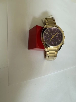 Reloj para dama CARAVELLE BY BULOVA esfera púrpura cronógrafo tono oro amarillo 37 mm Foto 1 de 4
