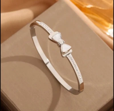 Mother Of Pearl Bow Knot Rhinestone Accented Stainless Steel Bangle Bracelet - Image 1 of 4