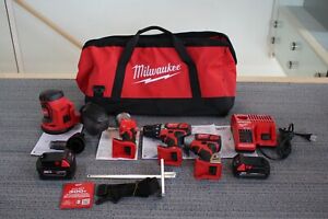 Milwaukee M18 4-tool Driver/Impact Driver combo kit w/Orbit Sander & Work Light