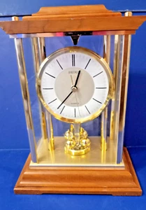 SEIKO TISCH- ODER MANTELUHR MIT ROTIERENDEM PENDEL (FUNKTIONIERT NICHT) - Bild 1 von 3