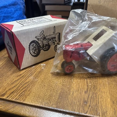 McCormick Farmall 200 Narrow Front Toy Tractor 1/16 New Old Stock Plastic In Box - Image 1 of 4