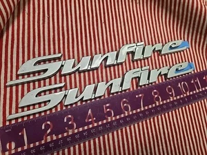 Nos Gm  1998-2004 Pontiac Sunfire Silver Emblem Badge Nameplate Name Plate Pair - Picture 1 of 5