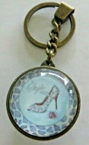 encased in glass with brass boarder, high heeled shoes, in style ,keychain