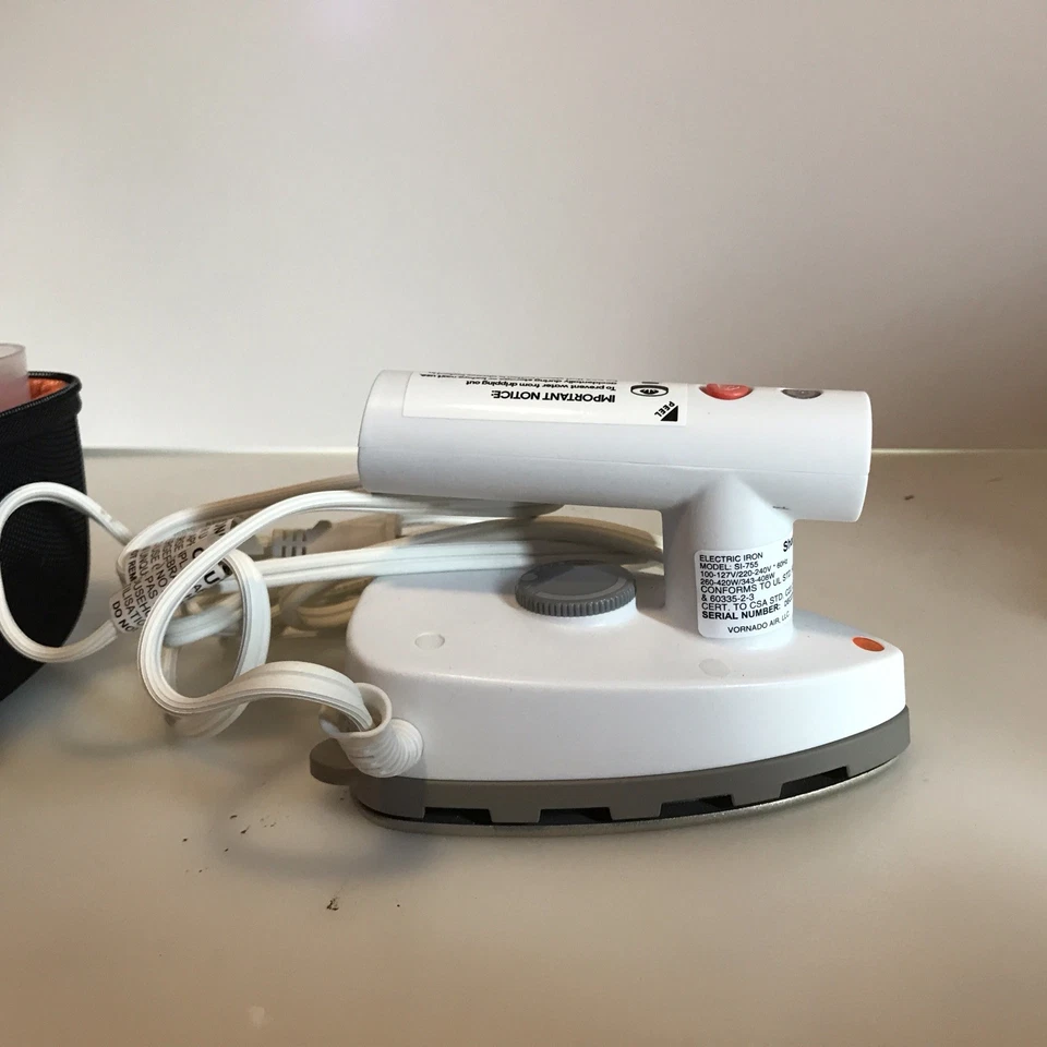 Plancha de vapor de doble voltaje Sharper Image Si-755 fuera de caja Foto 1 de 4