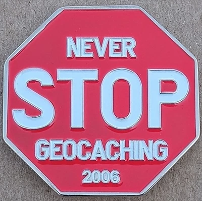 Geocoin Never STOP (2006) - Activada y Adoptable - TB1DZR2 Foto 1 de 2