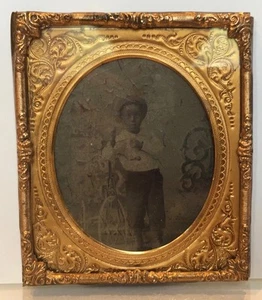 Full-length portrait of five- or six-year-old African American boy in hat 1875 - Picture 1 of 1