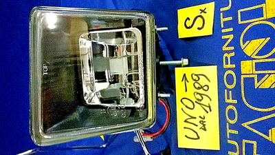 FENDINEBBIA FIAT UNO'1989 PROIETTORE SINISTRO FARO  COMPLETO  CARELLO ORIGINALE - Immagine 1 di 4