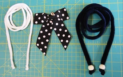 Cinturón con lazo de cinta negro blanco punto cierre a presión blanco 48 en azul marino 55 en terciopelo Foto 1 de 4