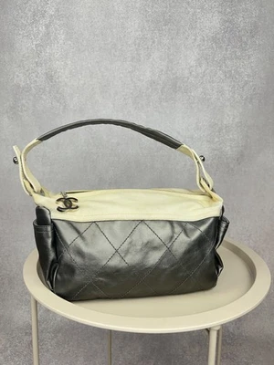 Bolso de Hombro Chanel Paris-Biarritz Vintage Cuero Negro y Lona Beige Foto 1 de 4