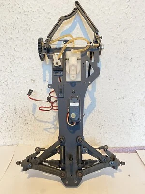 Kyosho F 2004,Vorderachse/Stoßdämpfer-Getriebewelle-Querlenker-Servoplatte- - Bild 1 von 4