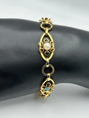 Brazalete de cadena tono dorado con eslabones florales de filigrana imitación perla y cuentas de aguamarina Foto 1 de 4