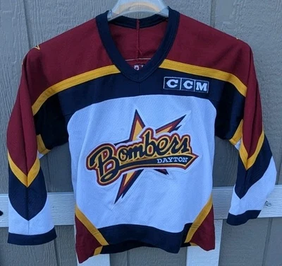 Camiseta deportiva Y2K Dayton Bombers juvenil pequeña blanca azul marino roja NHL hockey CCM niños Foto 1 de 4