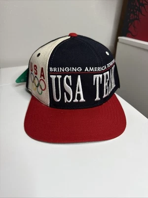 Sombrero de iniciación vintage del equipo de Estados Unidos Olympic SnapBack Bringing America Together años 90  Foto 1 de 4