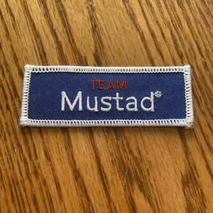 Team Mustad Embroidered Iron On Fishing Patch Company Logo Blue Red - Picture 1 of 2