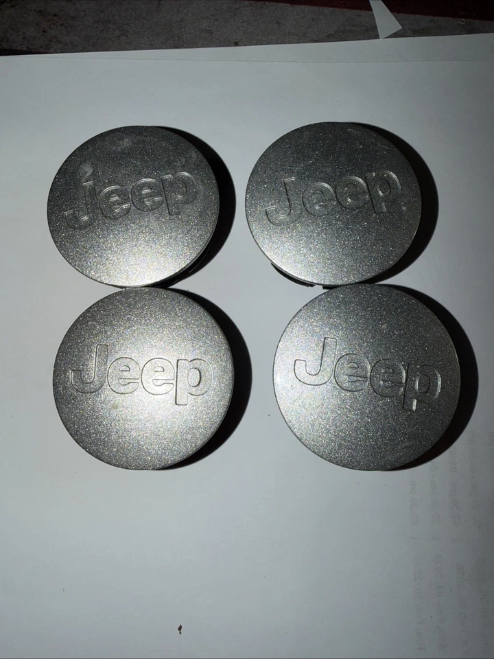 Tapas centrales plateadas originales Jeep Cherokee Compass JK JKU Wrangler MÁS (4) Foto 1 de 2