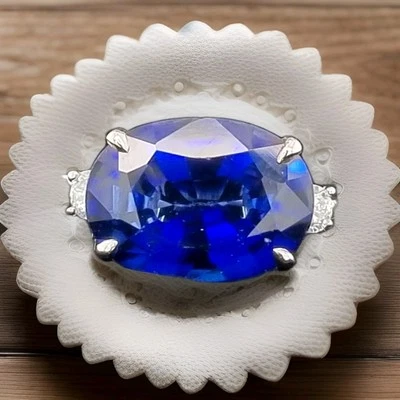 Anel de noivado vintage de platina 7,05 ct. Oval de safira azul marrom em laboratório  - Imagem 1 de 4