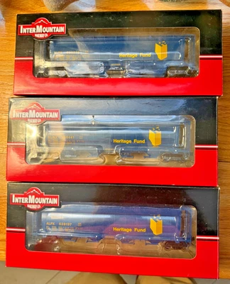 HO Intermountain Three Alberta Heritage Cylindrical Hopper Cars.  Diff Rd #s. - Image 1 of 4