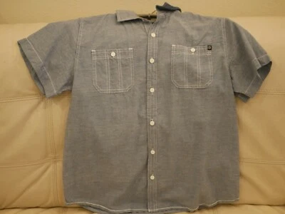 CAMISA DISTORSIÓN MANGA CORTA NUEVA NIÑO TALLA GRANDE AZUL CLARO BOLSILLOS DELANTEROS Foto 1 de 4