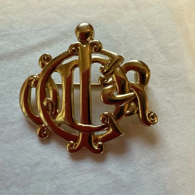 Prendedor/broche CHRISTIAN DIOR monograma logotipo CD Alemania tono dorado marcado vintage Foto 1 de 4