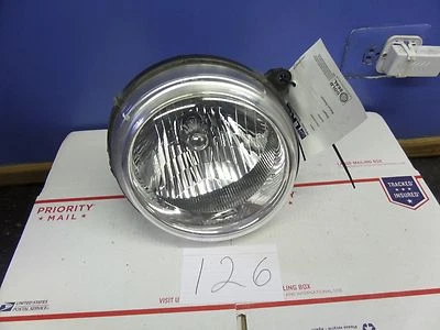 02 03 04 Faro halógeno lateral del conductor Jeep Liberty luz delantera Foto 1 de 4