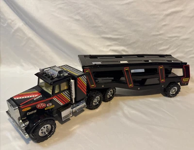 Remolque para carros semi de juguete de metal de 8 ruedas vintage Remco Castrol STP Goodyear de la década de 1980 Foto 1 de 4